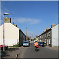 Charles Street and a cycling postman