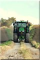 John Deere tractor on path to Heaton