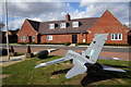 Model plane in front of the Air Cadets building