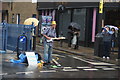 View of a barefoot guitarist on Talbot Road