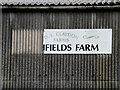 TL7248 : Broken Highfields Barn sign on Highfields Barn by Geographer