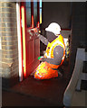 Preparing a door for repainting, platform 2, Teignmouth station