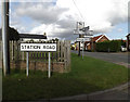 TM0562 : Roadsigns on Station Road by Geographer