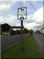 TM0562 : Old Newton Village sign by Geographer