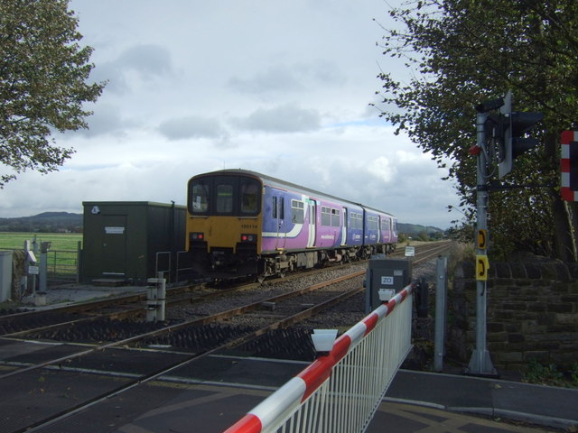 Train passing Four Lane Ends Level Crossing
