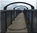 On the footbridge crossing the railway lines