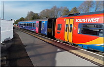 SU1485 : South West train and First train in Swindon by Jaggery