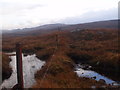 NH1999 : Boundary fence heading south-east from Langwell, Ullapool by ian shiell