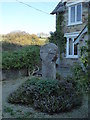 Ancient cross in the garden of Cross Cottage