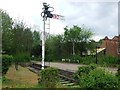 A signal a platform and a short length of track mark the site of Leicester West station