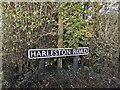 TM1782 : Harleston Road sign by Geographer