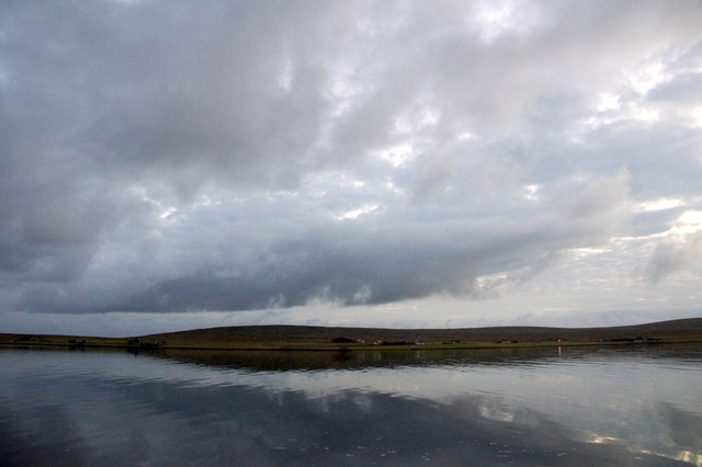 Grey skies over the voe at Baltasound at dusk