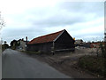 TM3372 : Barn & building site at Whitehouse Farm by Geographer