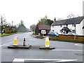 Junction of Mincing Lane with Chertsey Road with unusual bollard