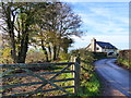 Gate, with cottage beyond, near Kincoed