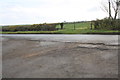 Gateway beside B4450 opposite track to Meads Farm