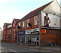 Stella Artois advert on a barber shop side wall in Highbridge