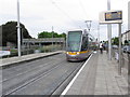 O1232 : Dublin - LUAS tram entering Drimagh Tram stop by Colin Park