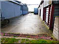 Path between buildings in yard