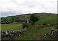 Approaching the farm house and outbuildings on the Moat Pad