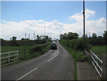 NU1530 : Road over Level Crossing by Les Hull