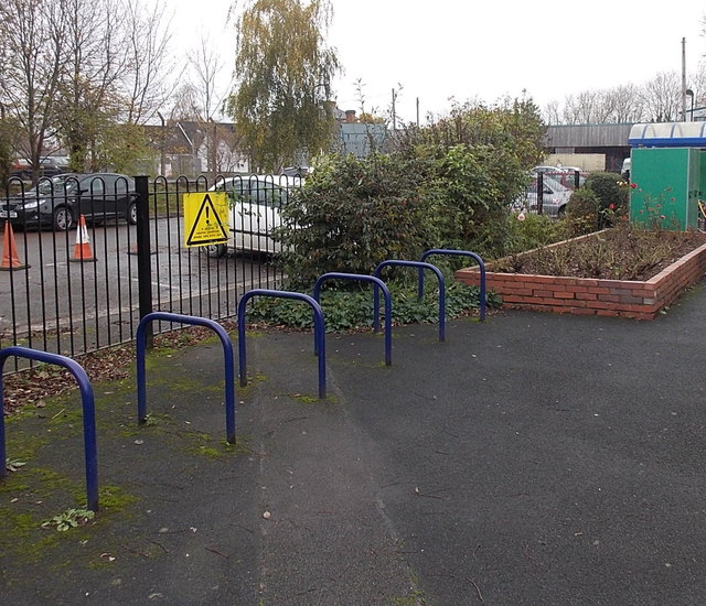 Bicycle racks and a notice stating the obvious, Pershore railway station by Jaggery