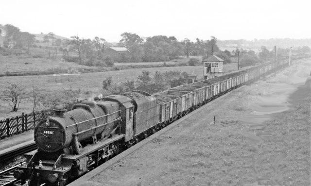 Down mineral train passing closed Killamarsh station, 1963