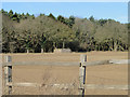 Brick military building on the edge of a field