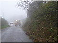 Hedge cutting in the mist on a minor road near Spriddlestone