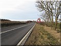 NU1231 : The northbound A1 at Adderstone Mains by Graham Robson