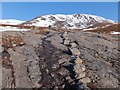 NH1311 : Boulders marking hill path over bare rock by Alpin Stewart