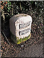 A restored milestone at Longtown