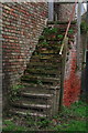 Stairway and weeds leading to a barn loft, Toft next Newton