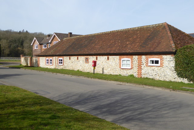 Old farm building with post box
