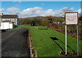 Mesh covered notice,  Brynteg,  Heol-y-cyw