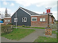 Westhall village hall and village sign in the foreground