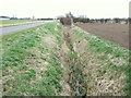 Drain beside minor road, Howdales