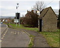 Bus shelter and a green sign in Westbury-on-Severn 