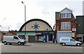 SJ8896 : Church and Betting Shop by Gerald England