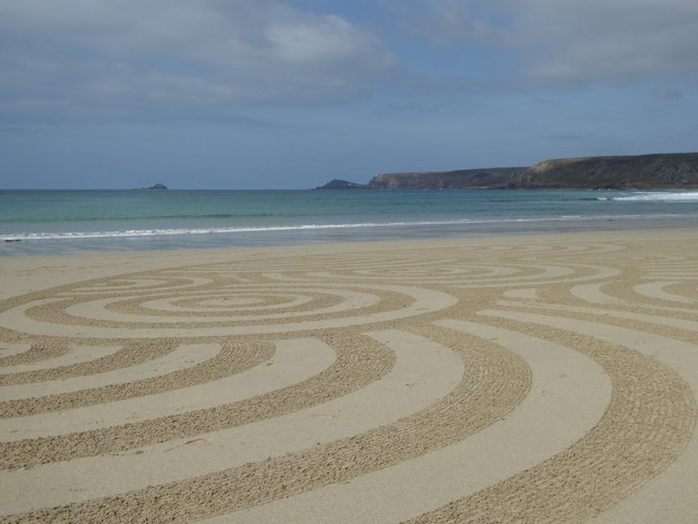 Sand art on the beach at Sennen Cove
