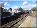 A train leaves Bruce Grove station