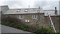 Cottages on the steep hill away from Mawgan Porth