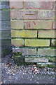 Benchmark on Kingfisher Drive wall