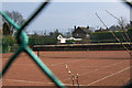 Peering through the wire fence at Stockton Heath Lawn Tennis Club