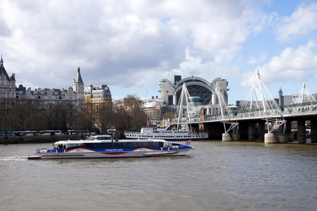 Tour boat about to go under the Hungerford Bridge, from the South Bank