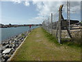 Footpath alongside the boat storage yard