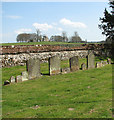 TL9078 : A row of headstones by Evelyn Simak
