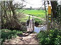 SK4619 : Footbridge by the ford by Ian Calderwood