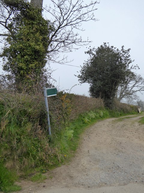 Start of a footpath along a track at the edge of Colyford