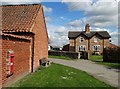 Houses and Victorian post box in Saxby